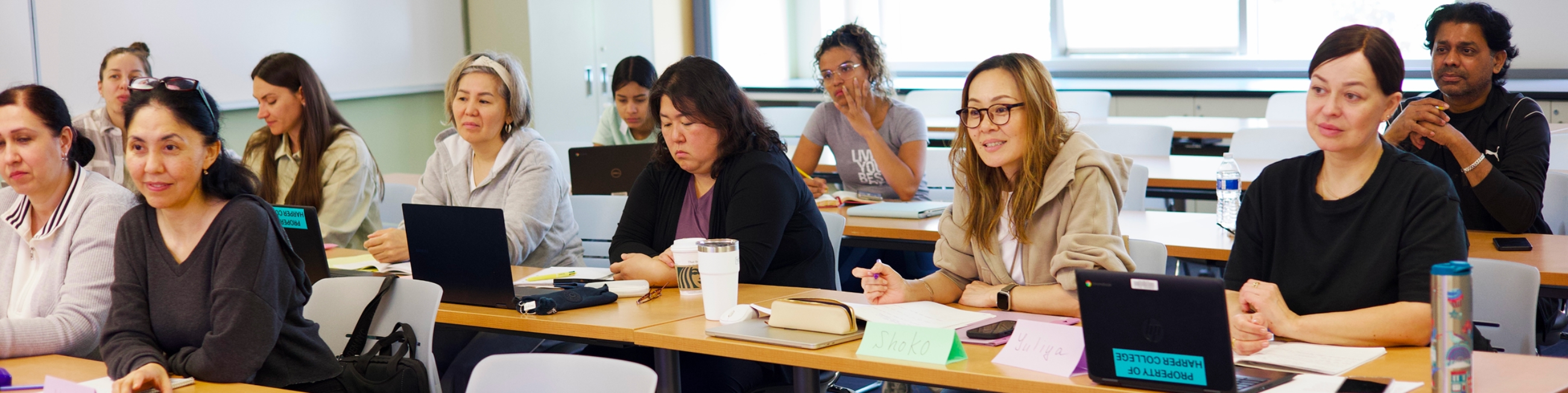 Students in Harper AED's English Literacy Acquisition (ELA) program listen to a lecture in a classroom on the Harper College campus in Palatine, Illinois.