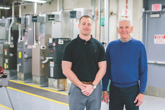  Dick Kolze and Peter Tschammer stand in the HVAC lab