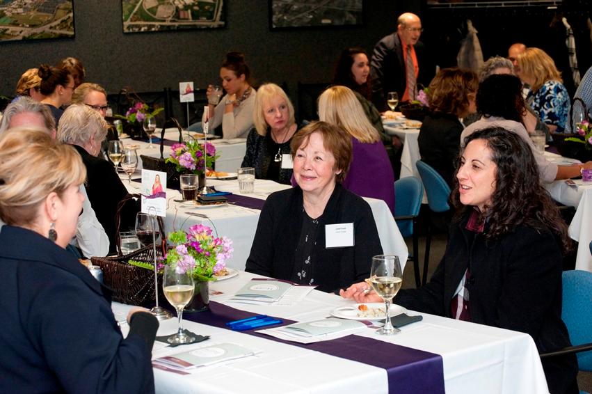 Event guests speaking with each other Event guests speaking with each other