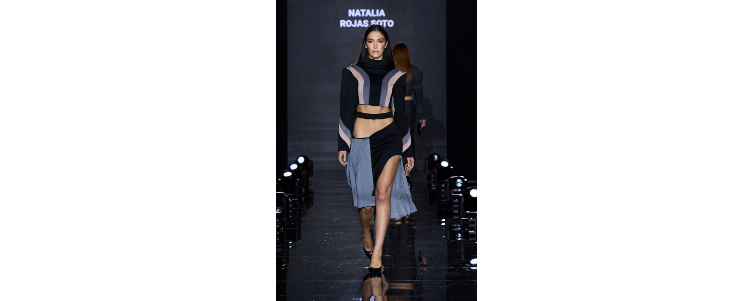 Model wearing a Harper College Fashion Studies student design on the runway at the Fashion & Talents show in Rome.