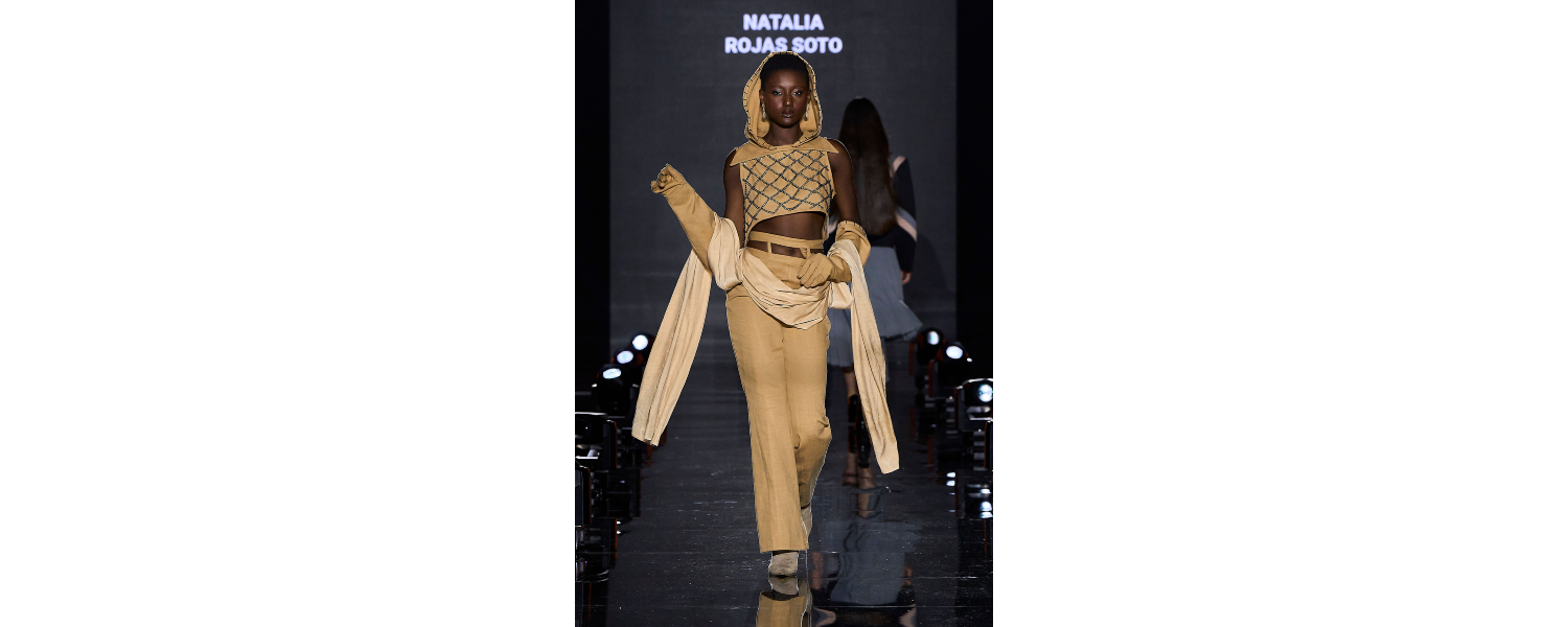Model wearing a Harper College Fashion Studies student design on the runway at the Fashion & Talents show in Rome.
