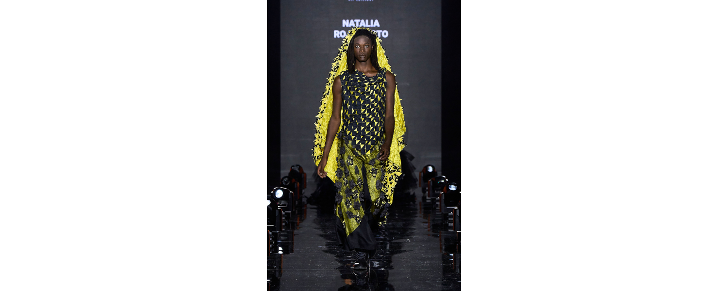 Model wearing a Harper College Fashion Studies student design on the runway at the Fashion & Talents show in Rome.
