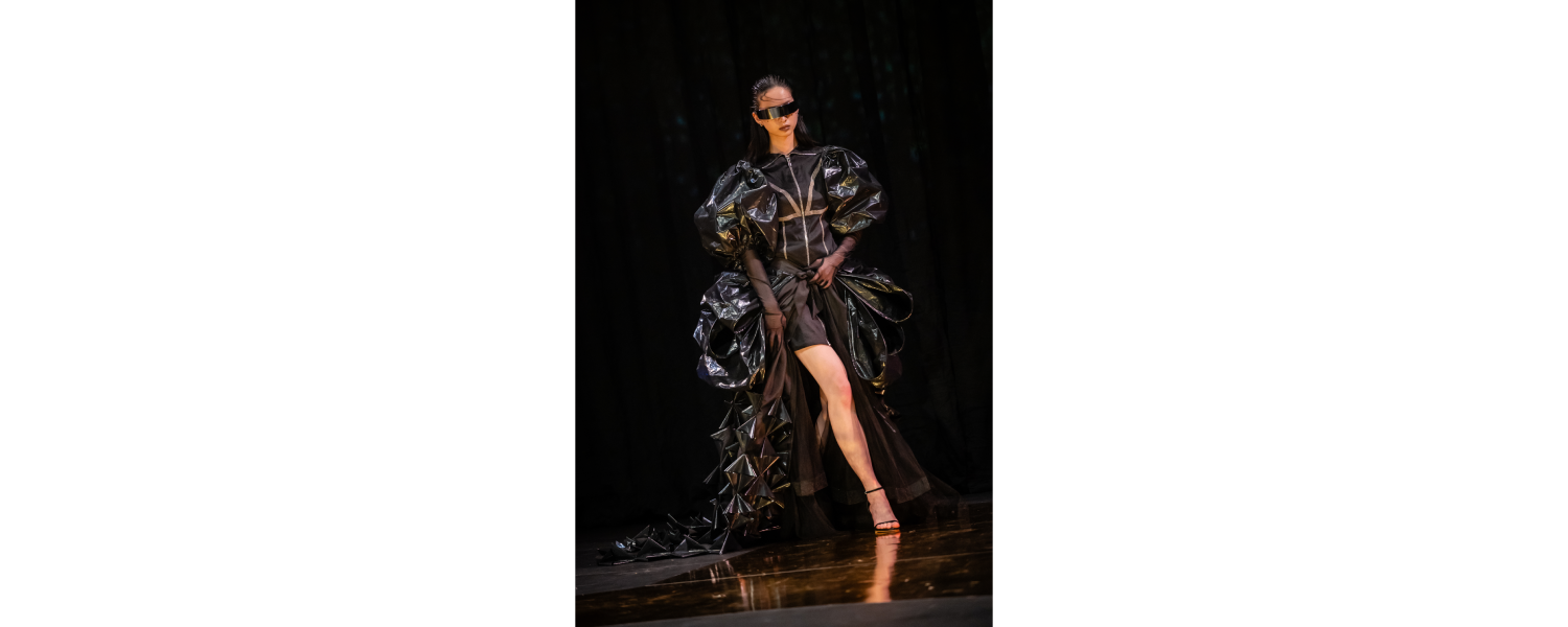 Model wearing a Harper College Fashion Studies student design on the runway at the Fashion & Talents show in Rome.