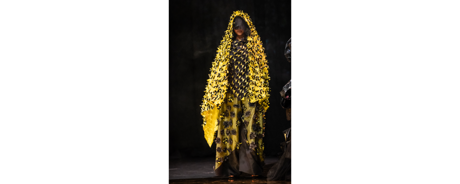 Model wearing a Harper College Fashion Studies student design on the runway at the Fashion & Talents show in Rome.