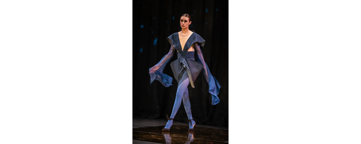 Model wearing a Harper College Fashion Studies student design on the runway at the Fashion & Talents show in Rome.