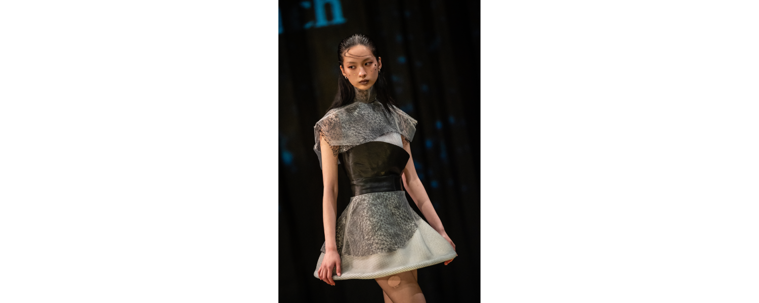 Model wearing a Harper College Fashion Studies student design on the runway at the Fashion & Talents show in Rome.