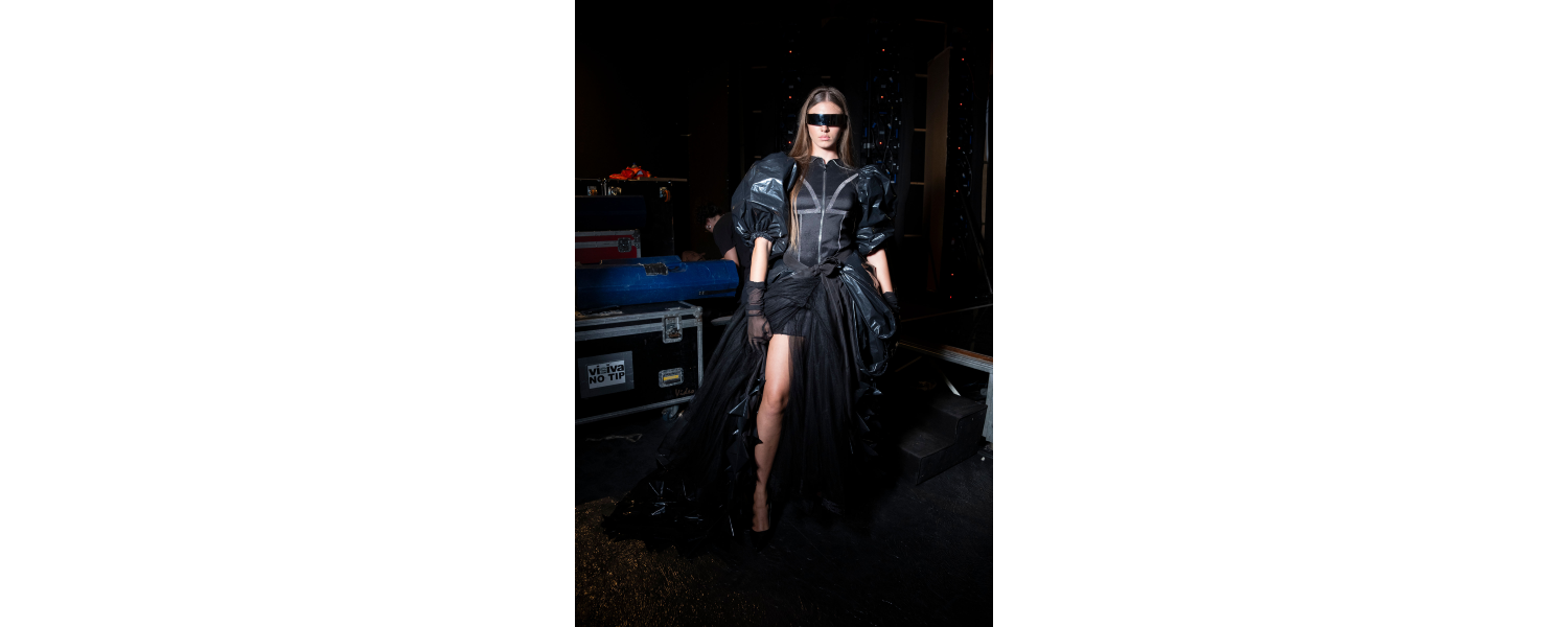 Natalia Rojas Soto black garbage bag dress backstage in Rome
