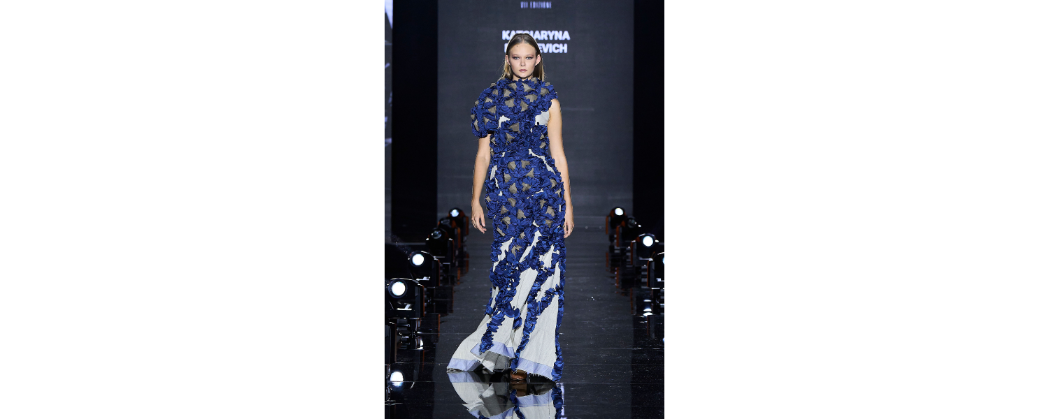 Model wearing a Harper College Fashion Studies student design on the runway at the Fashion & Talents show in Rome.