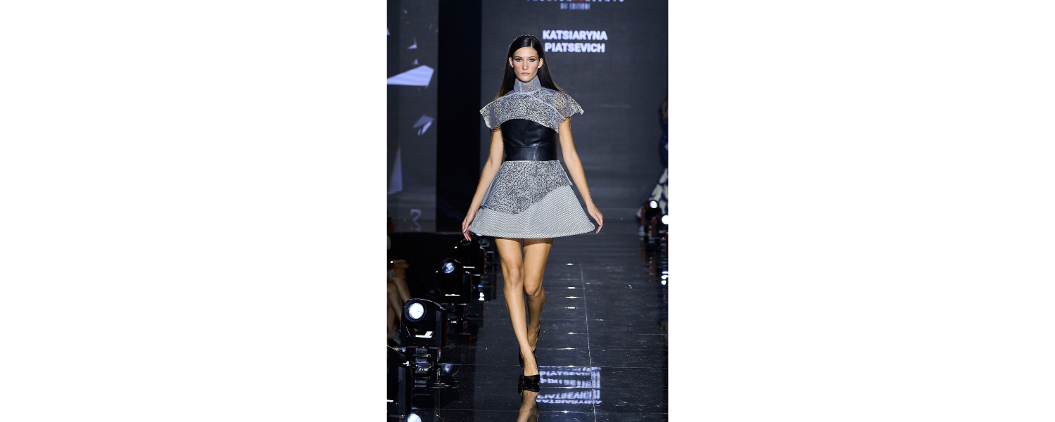 Model wearing a Harper College Fashion Studies student design on the runway at the Fashion & Talents show in Rome.