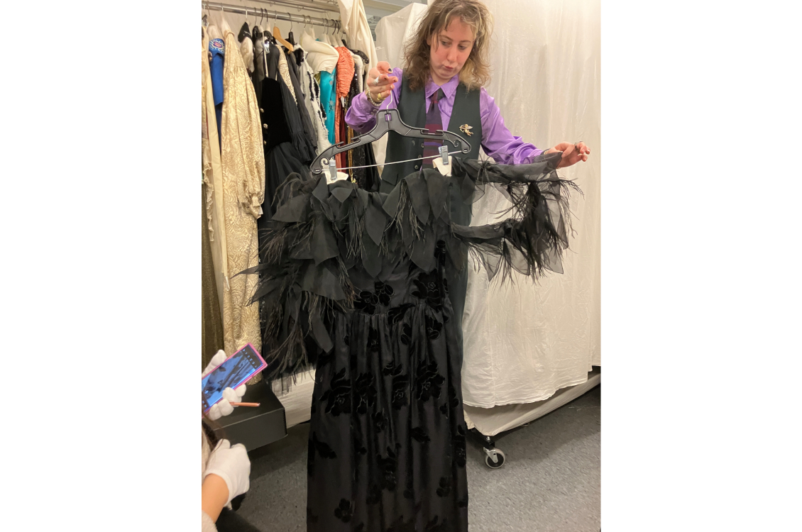 Feathered and ruffled black evening gown.