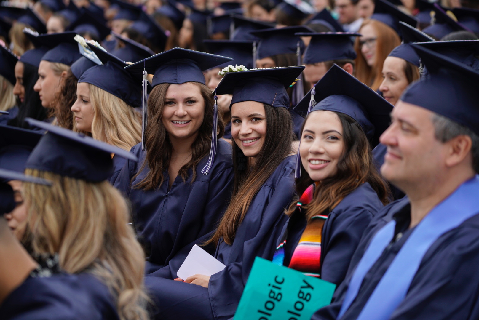 Harper graduates sit at the commencement ceremony