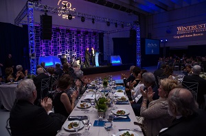 Guests applauding at 50th Anniversary Gala