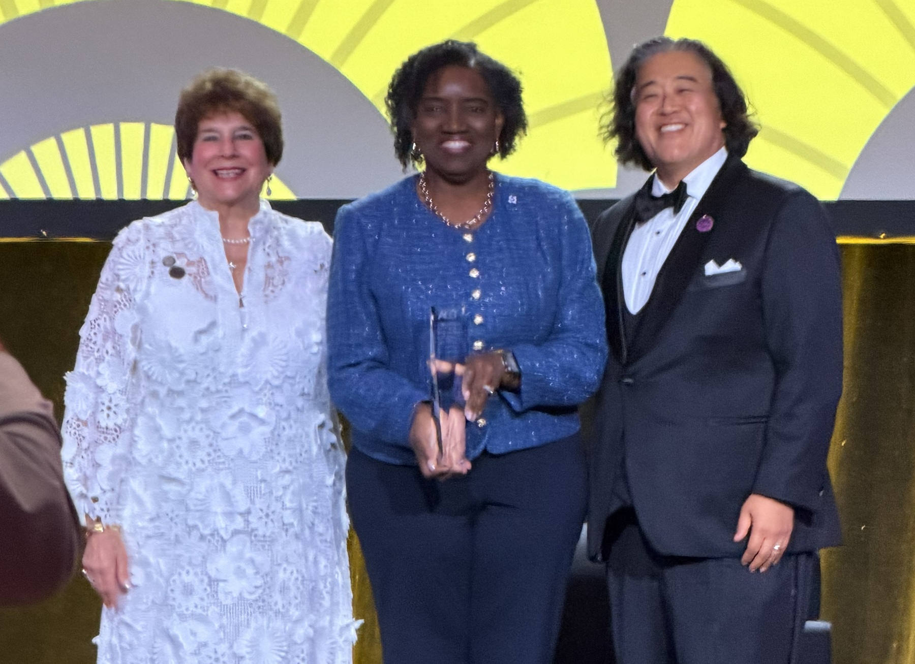 ACCT Board Chair Carol Del Carlo stands with Harper College President Dr. Avis Proctor and ACCT President and CEO Jee Hang Lee