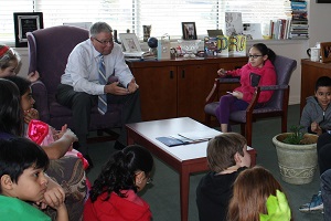 Dr. Ender meets with Ambassador School students in his office