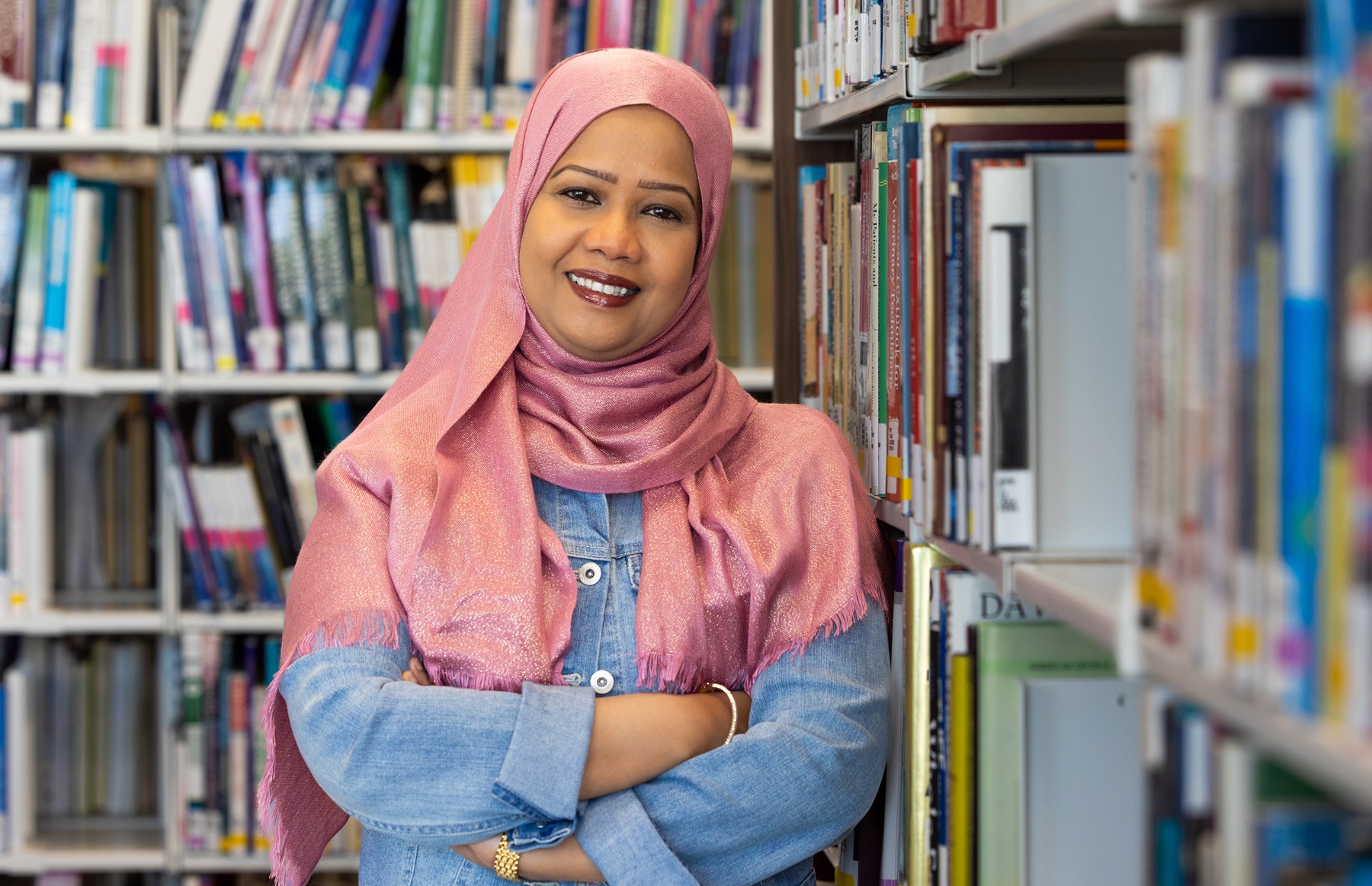 Asfa Alamelhuda Asfa Alamelhuda poses in the library at Harper College.