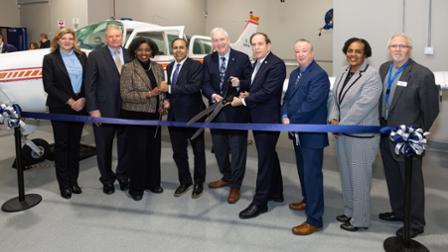 Harper College leaders, elected officials and Harper trustees cut the ribbon on the Aviation Maintenance Lab.