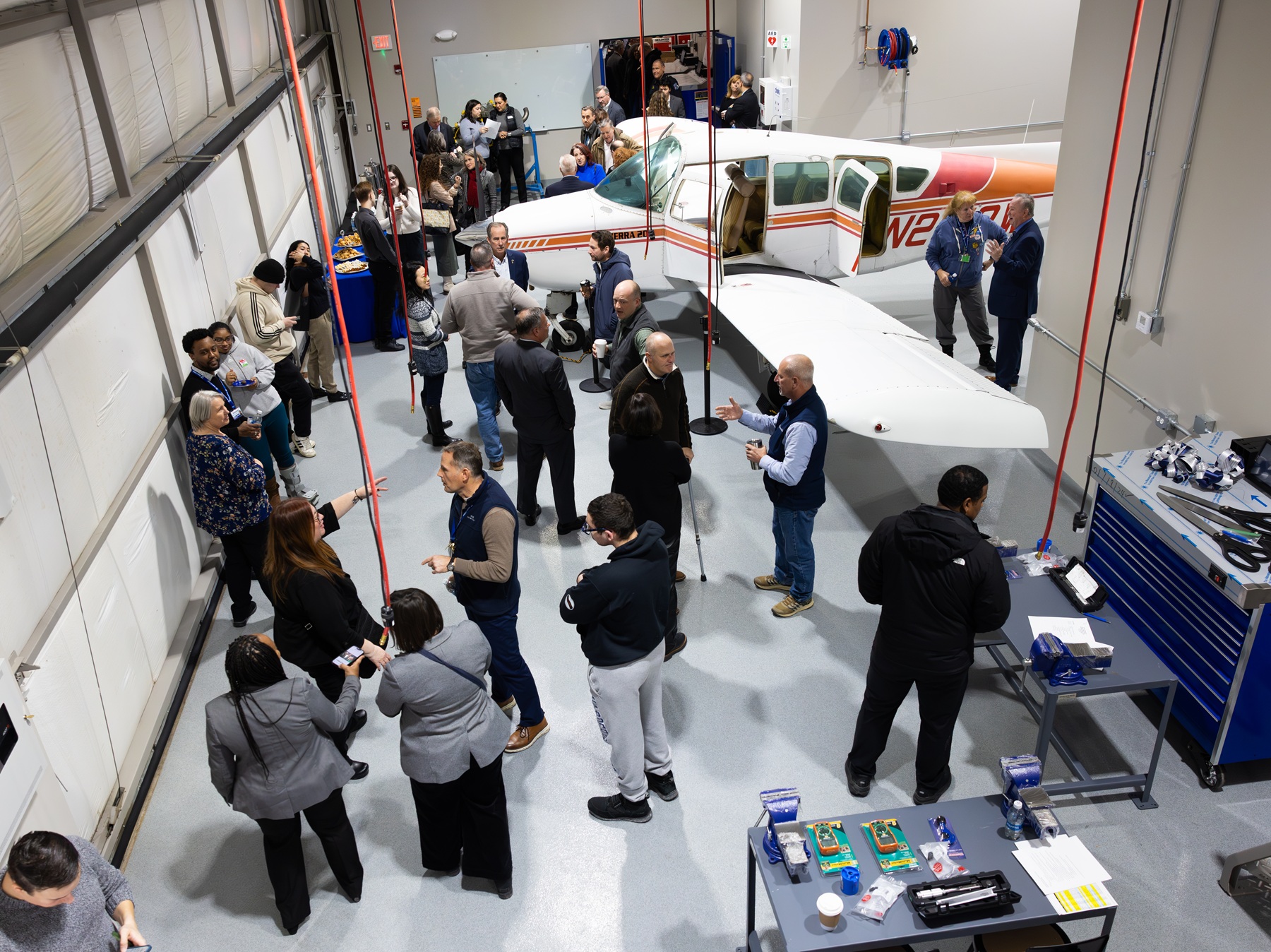 A portion of Harper College's Aviation Maintenance Lab is seen, including a 1974 Beechcraft Sierra airplane, during the lab's ribbon-cutting ceremony.