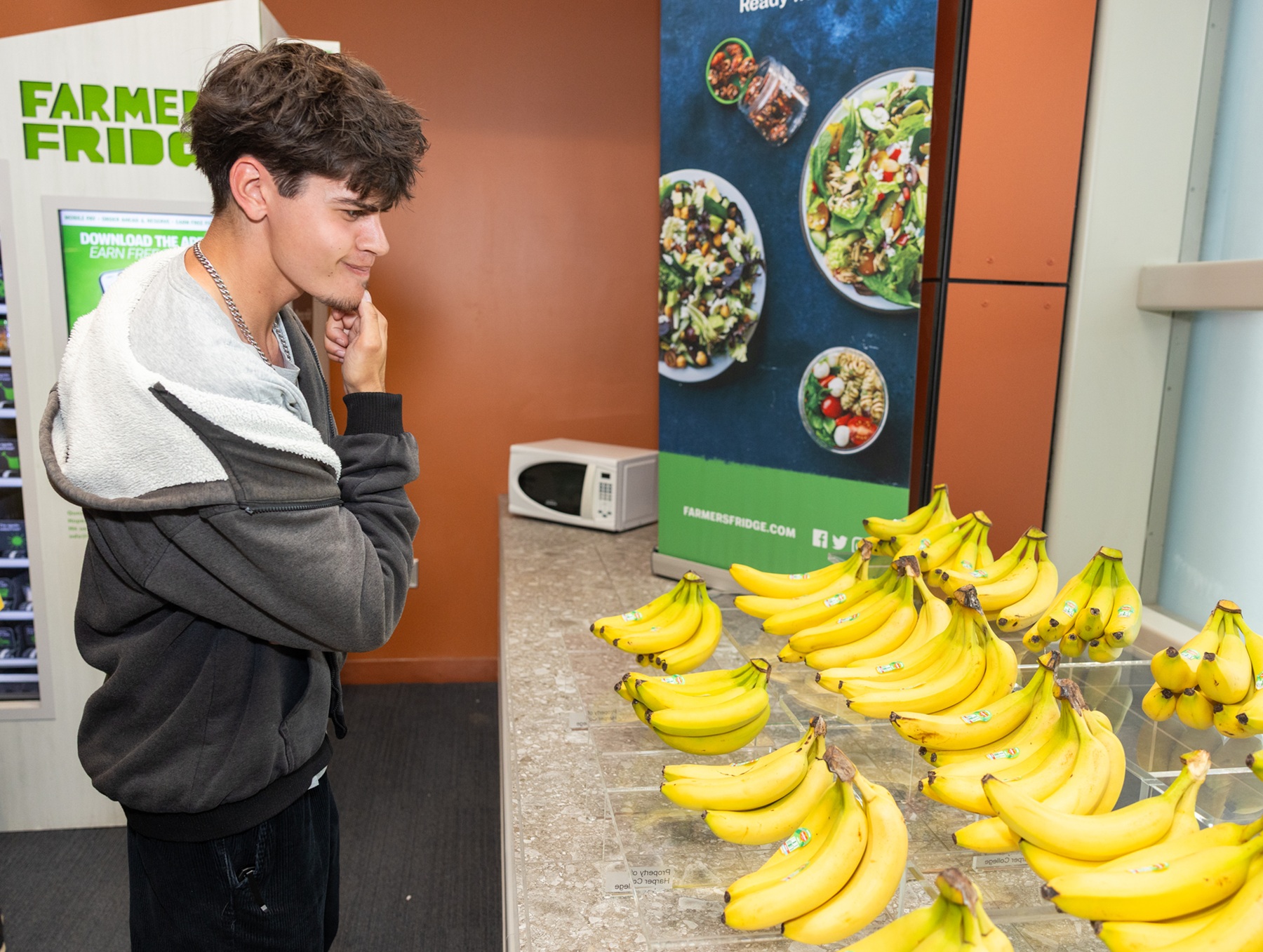 A student decides which banana to choose from the Banana Lounge at Harper College