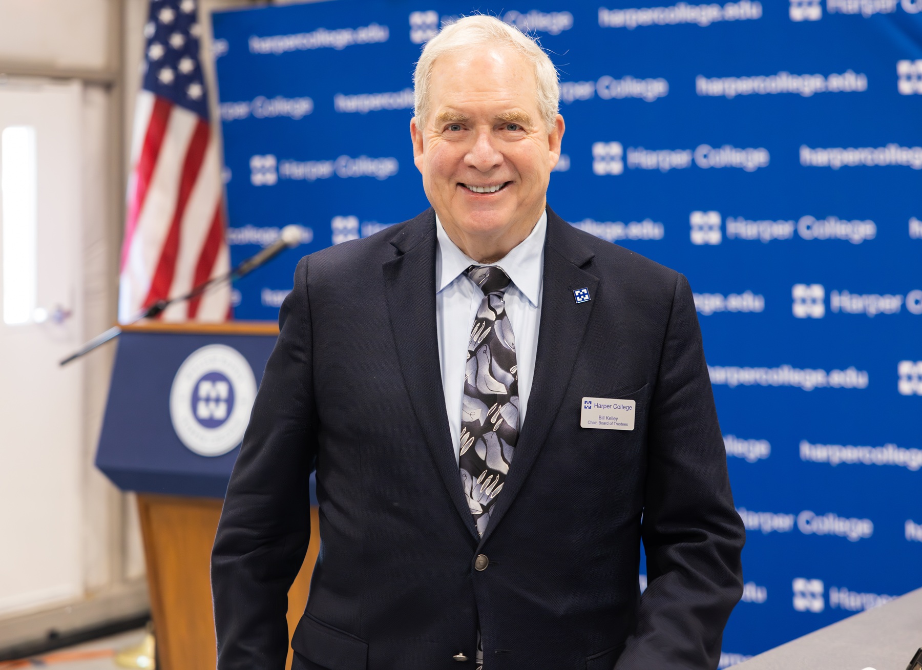 Bill Kelley in front of a Harper College lectern