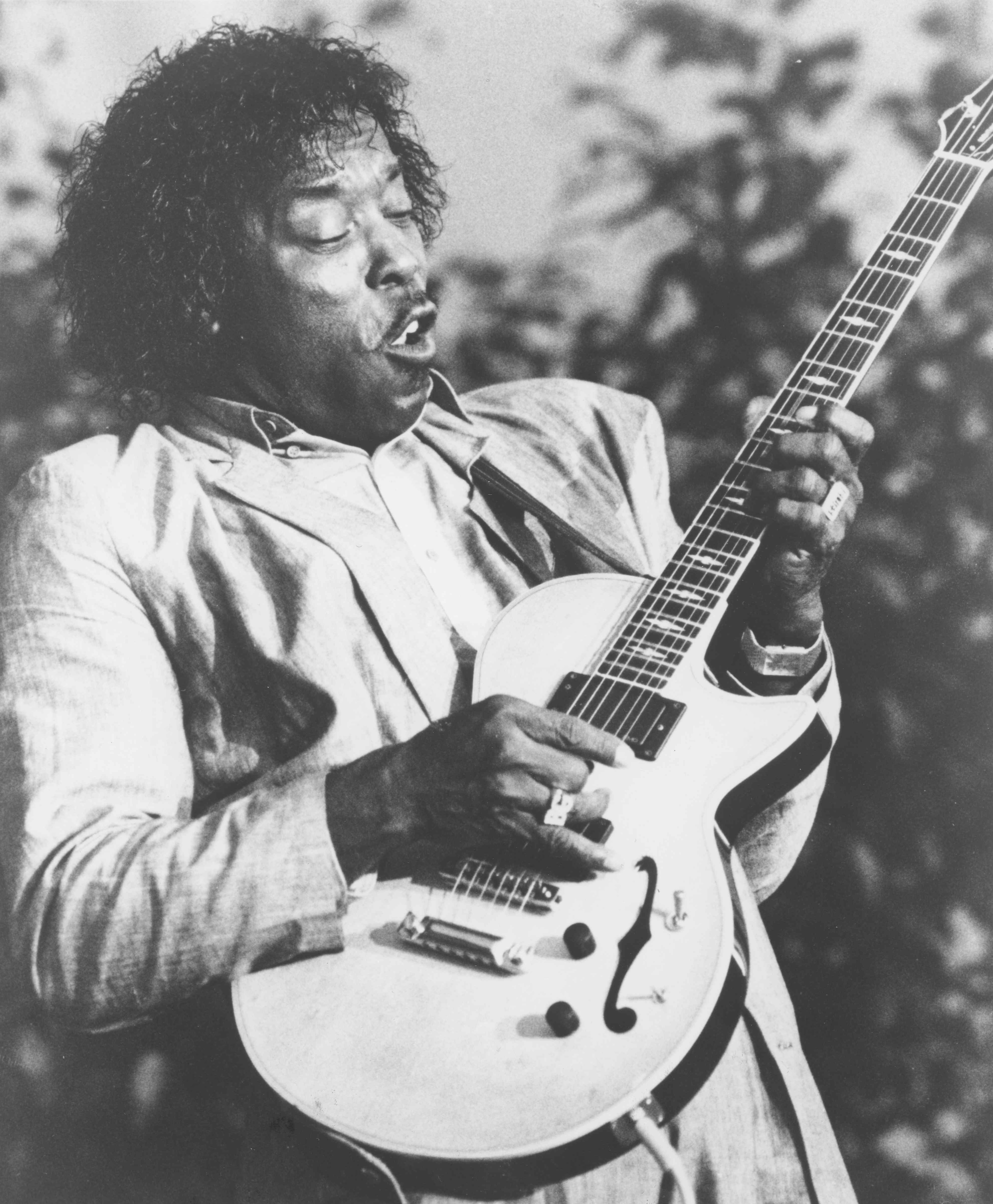 Buddy Guy is shown playing guitar in a 1990 publicity photo