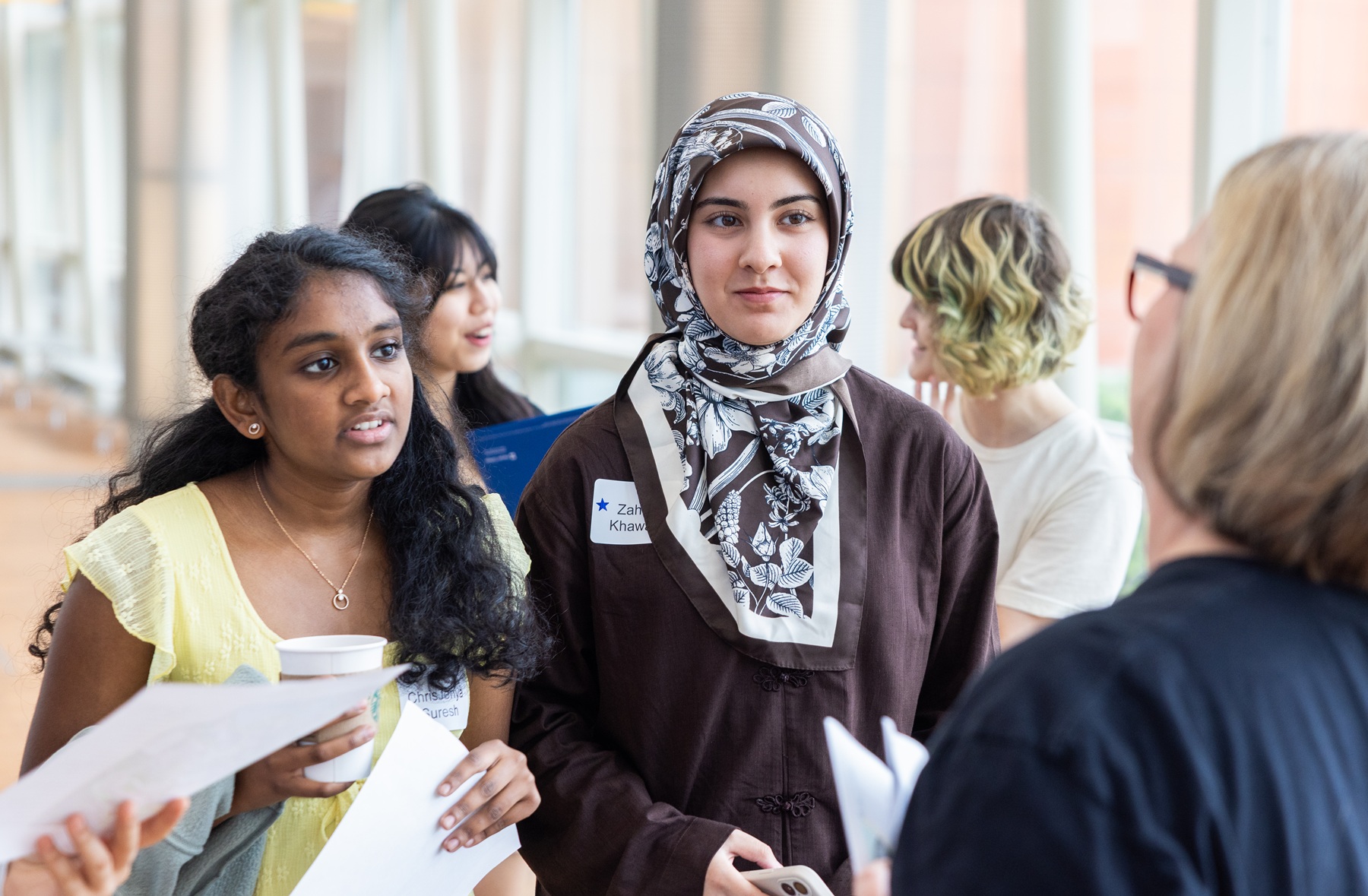 Chris Jenya Arokiya Suresh and Zahra Khawari stand in Avante Center during a tour of Harper College