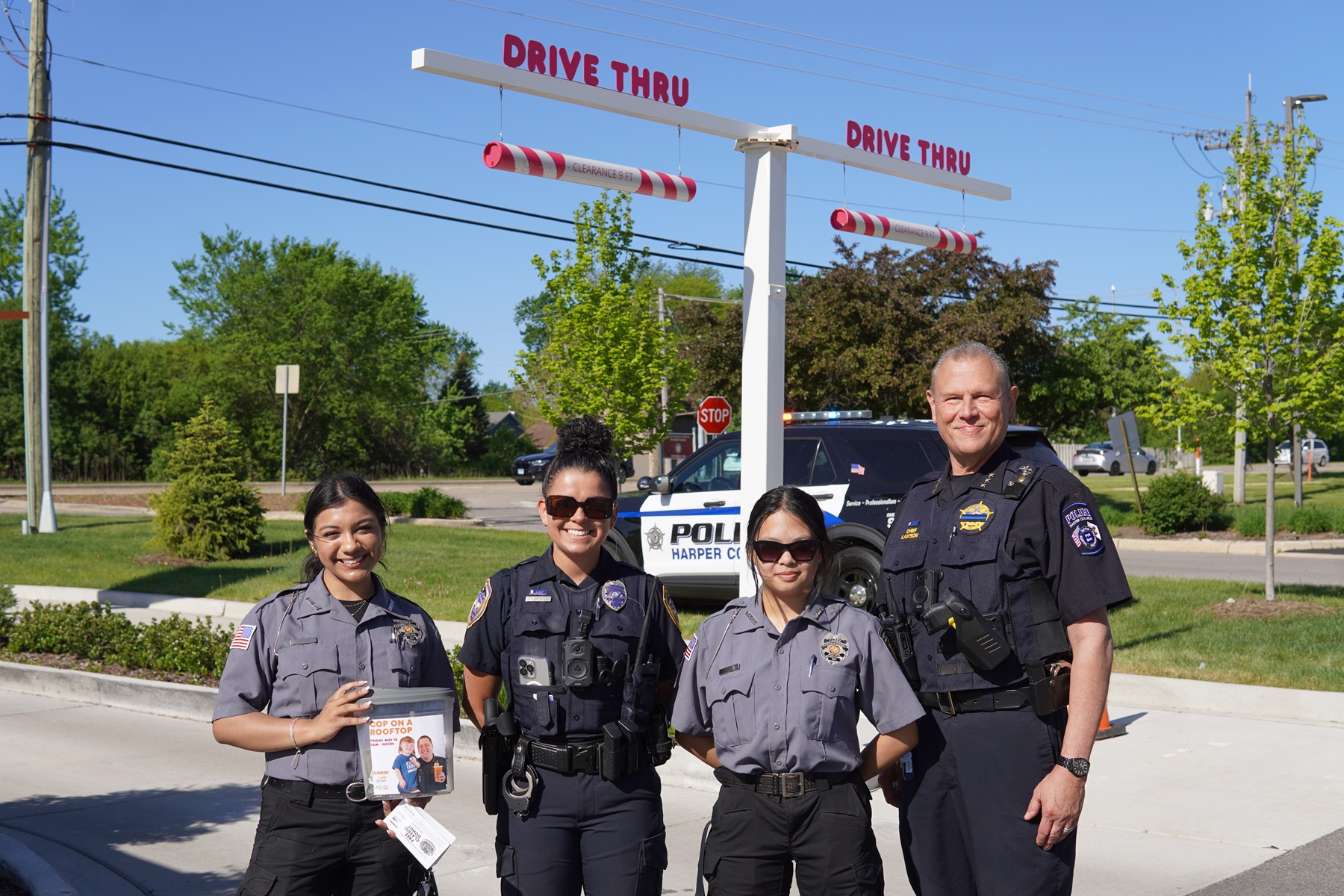 Harper College Police Chief John Lawson stands with other law enforcement officials at a Cop on a Rooftop fundraiser