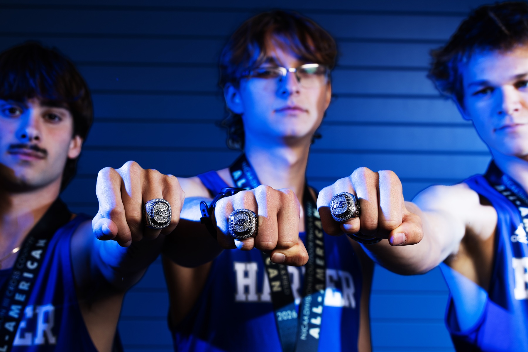 Cross Country Regionals Three Harper cross country athletes show their championship rings