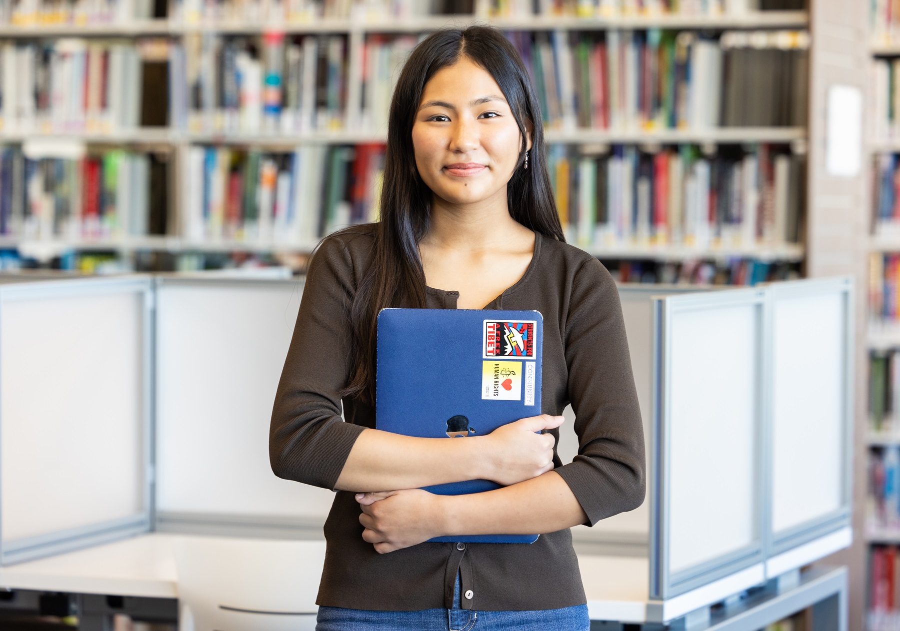 Dechen Atsatsang poses in the Harper College library