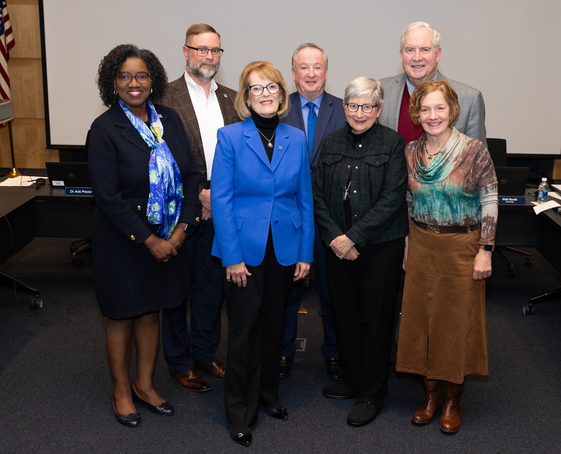 Dr. Avis Proctor and Harper College Board of Trustees members Eric Knox, Walt Mundt, Pat Stack, Bill Kelley and Nancy Robb pose for a photo with Diane Hill