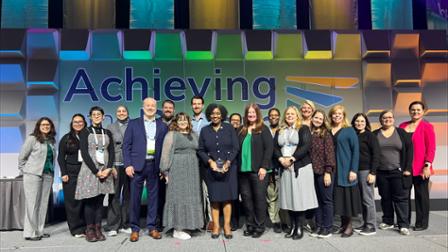 Harper College faculty, staff and administrators on stage at Achieving the Dream
