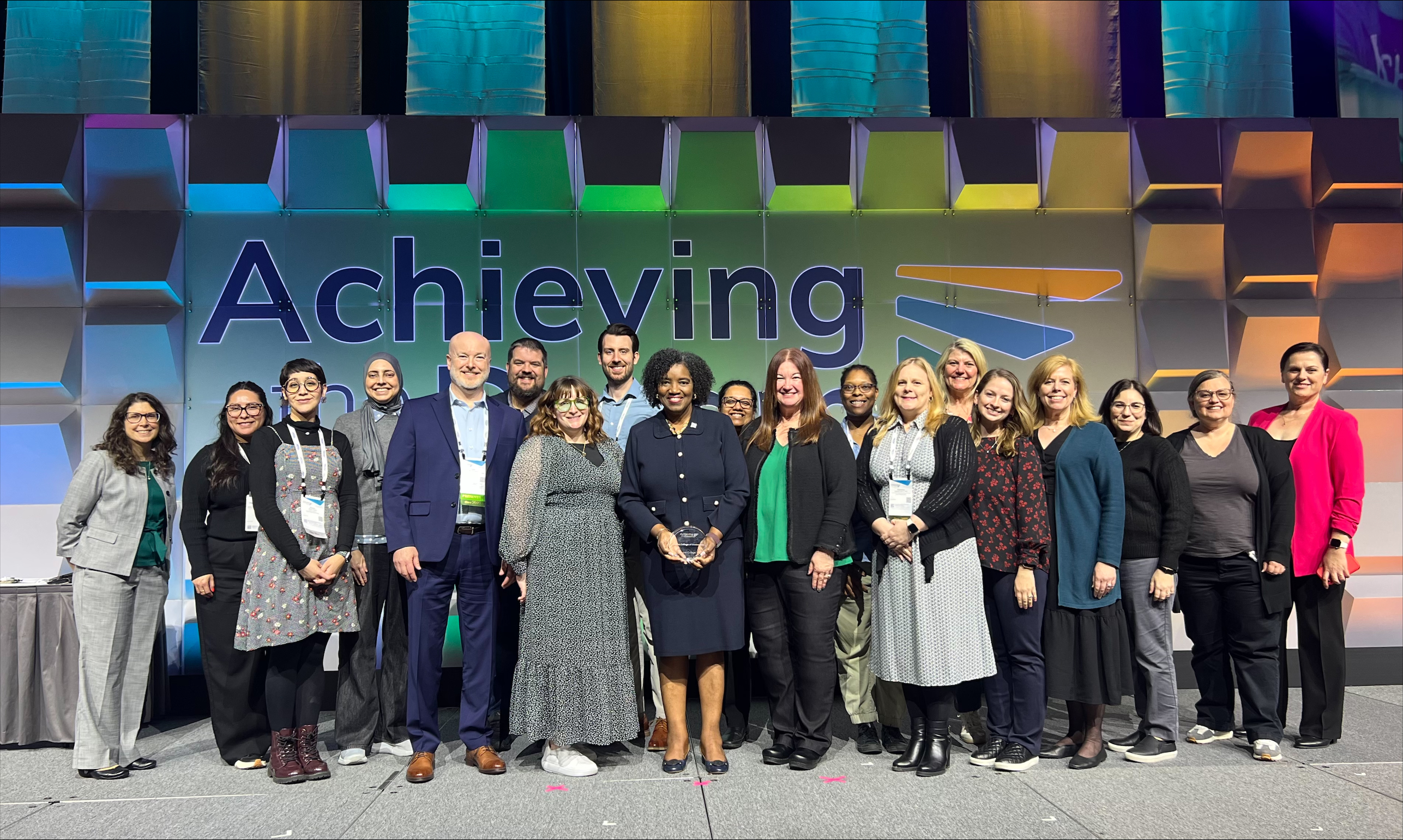 Harper College President Dr. Avis Proctor is joined by several Harper colleagues on stage at the Achieving the Dream conference