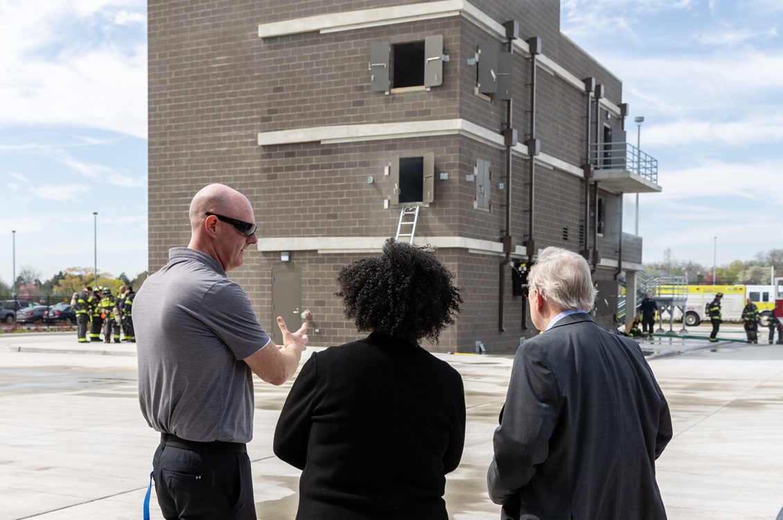 Norm Bemis, Dr. Avis Proctor and Sen. Dick Durbin look at the Harper College Emergency Services Training Center.