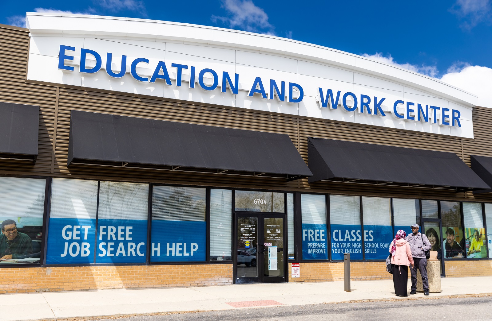 A couple walks into the Education and Work Center in Hanover Park.