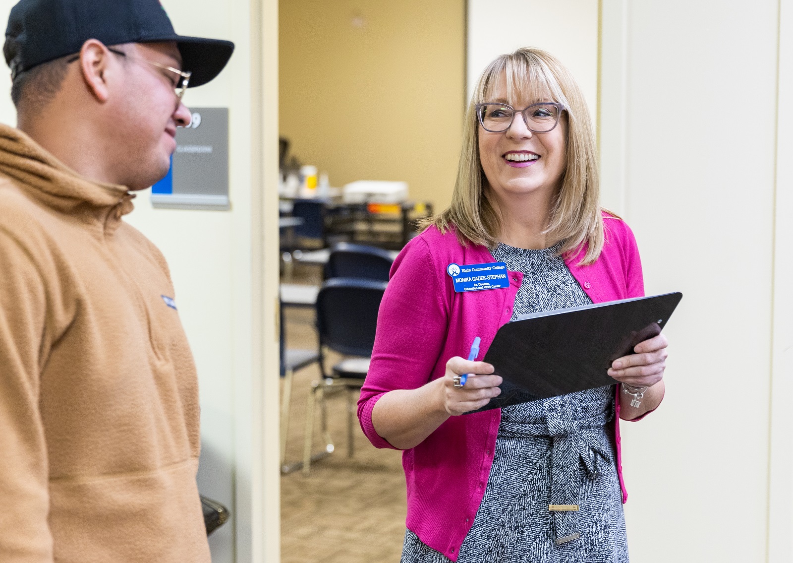 Monika Gadek-Stephan interacts with a visitor to the Education and Work Center.