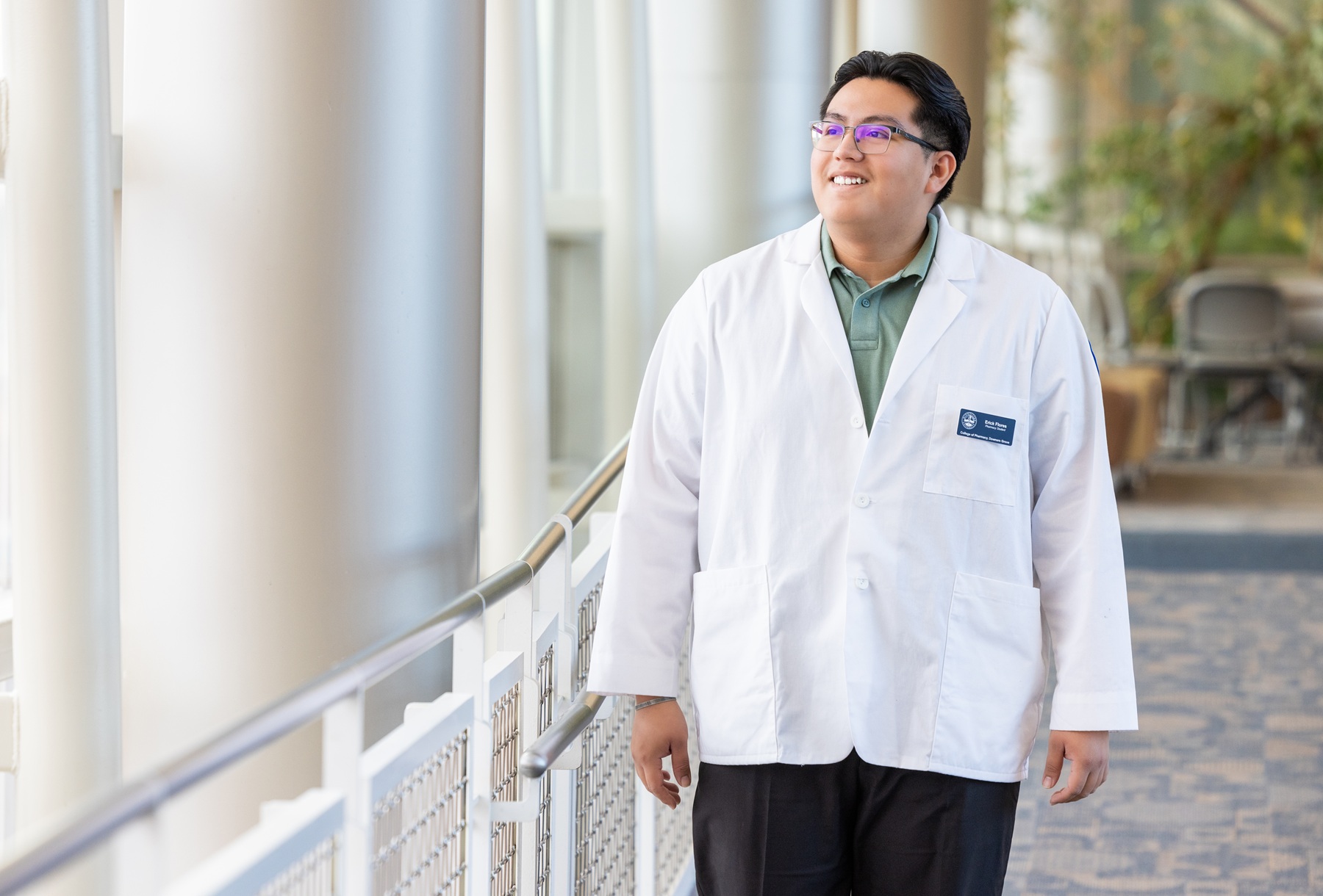 Erick Flores walks on Harper College's campus