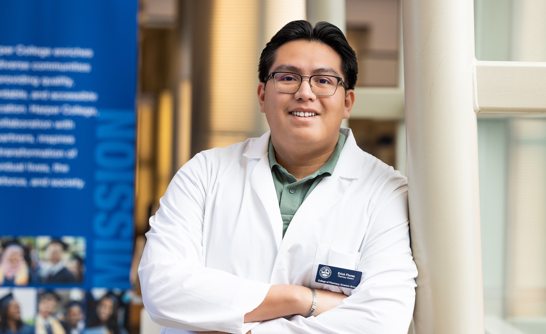 Harper alum Erick Flores stands in the Avante Center