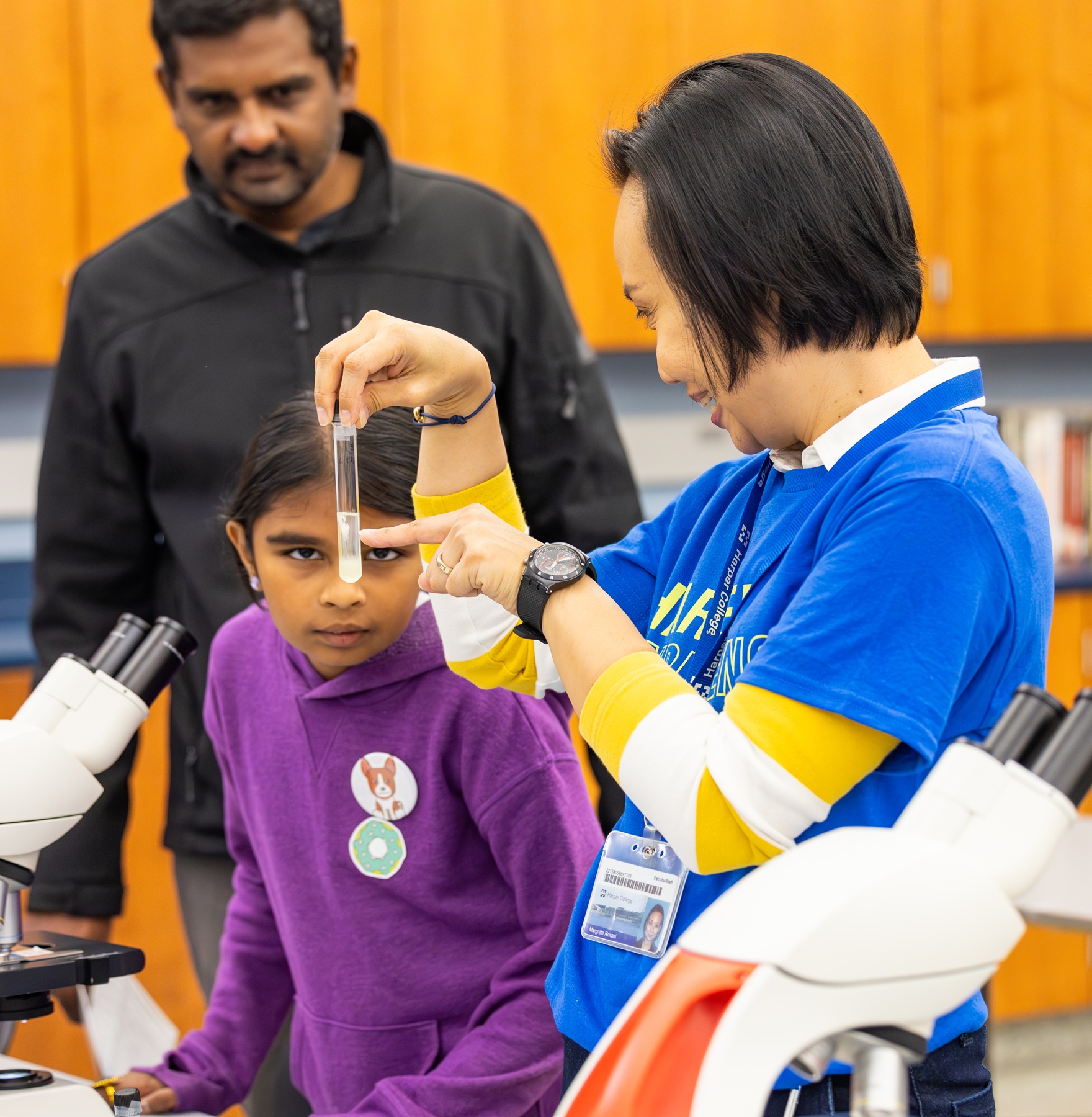 A  young student takes part in a science experiment at Experience Day