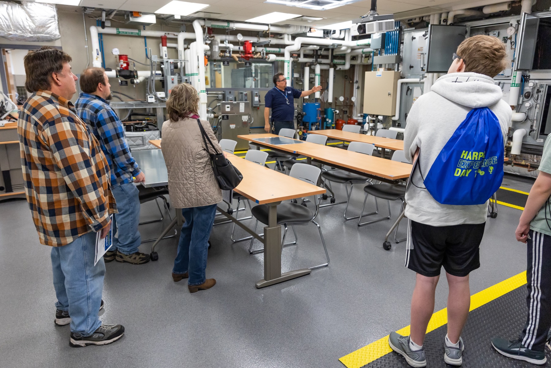 Students and parents take a tour of Harper College's HVACR Lab during Expeirence Day 2022