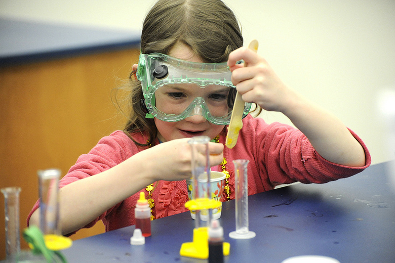 A girl conducts a science experiment