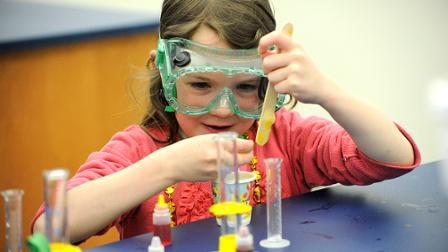 A girl conducts a science experiment