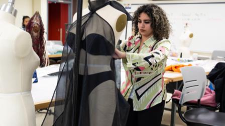 Harper College students work on their fashion show pieces