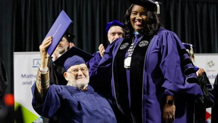 Bernie Bluestein is awarded an honorary degree by Dr. Avis Proctor, president