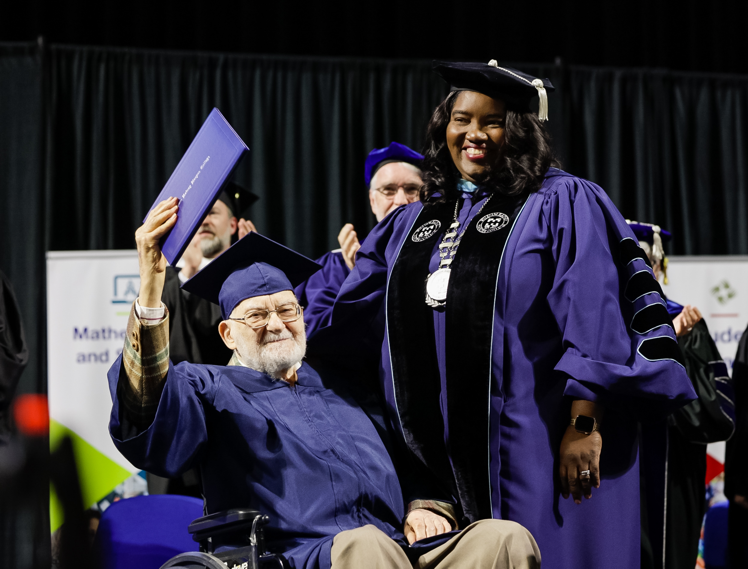 Dr. Proctor presents Bernie Bluestein with an honorary degree