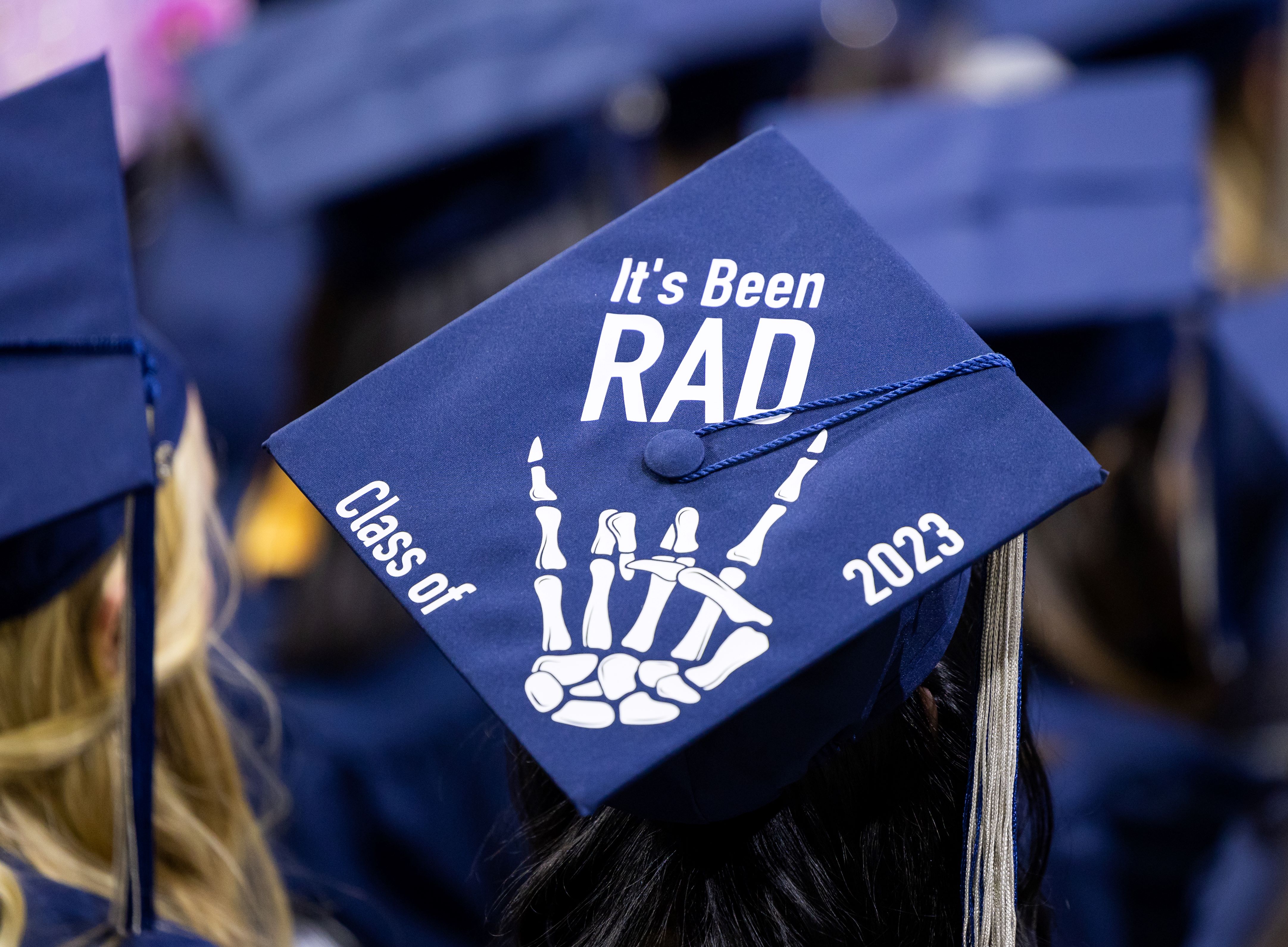 A radiologic technology graduate's hat says it's been rad with a skeleton hand