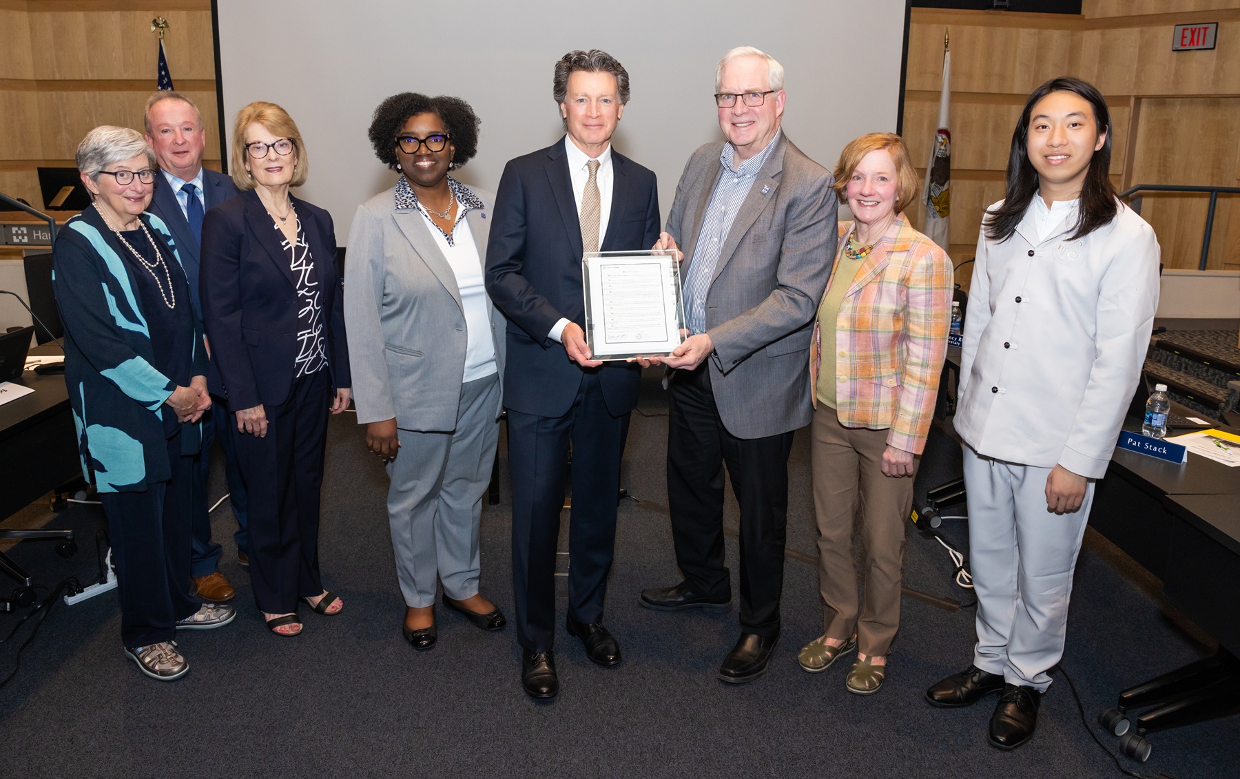Outgoing Trustee Greg Dowell stands with the Harper College Board of Trustees at the April 2025 meeting.