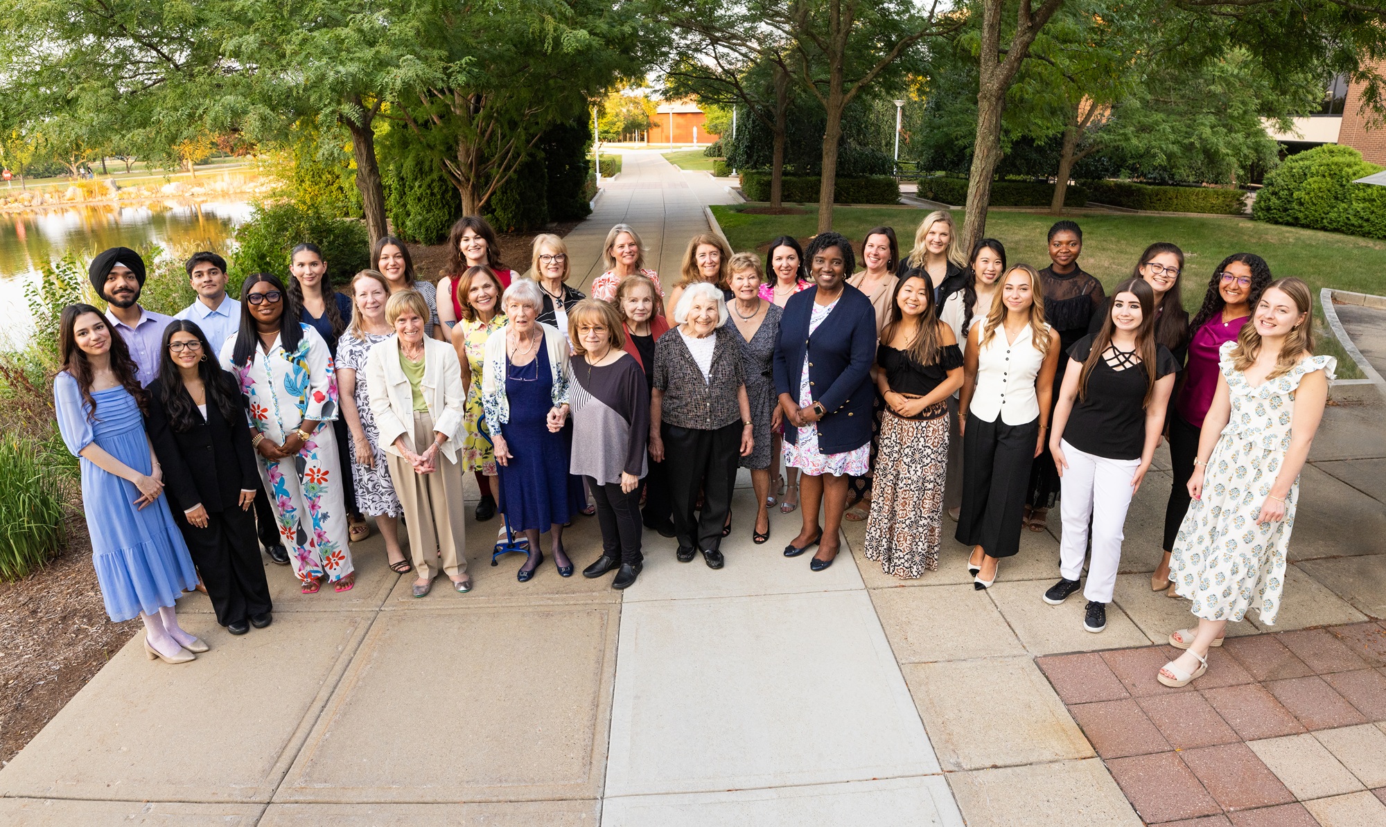 HOPE Giving Circle members and scholars gather outside on Harper's campus