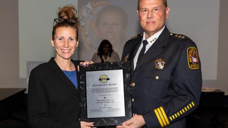 Laura King, Illinois Association of Chiefs of Police, poses with Harper Chief of Police John Lawson