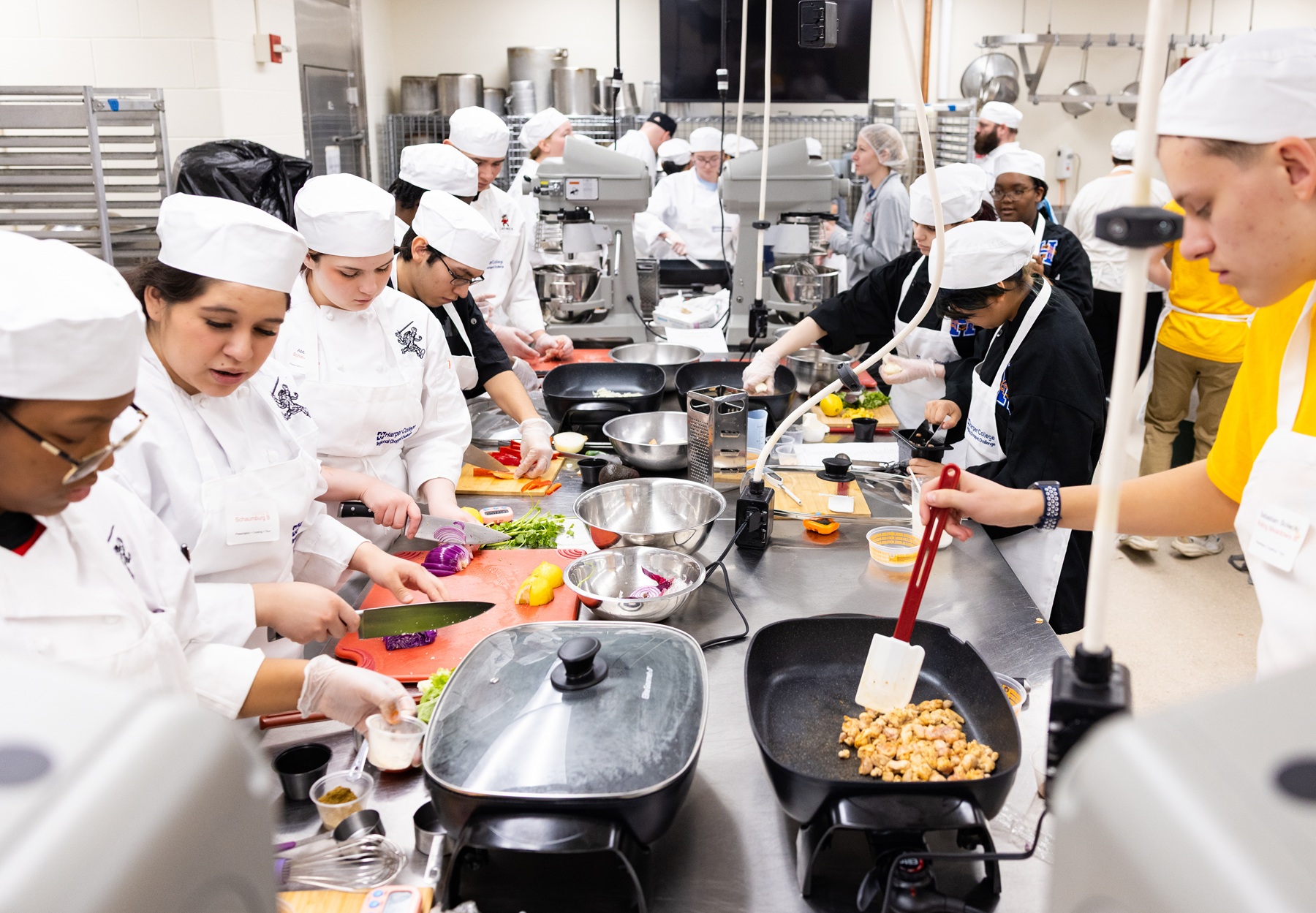 High school dual credit students cook in the Harper College Culinary Competition