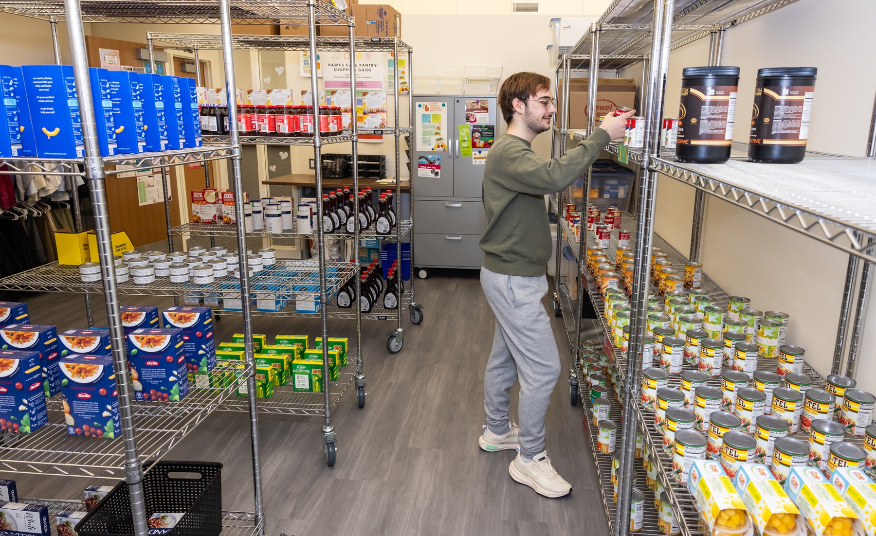 A student browses the Hawks Care food pantry