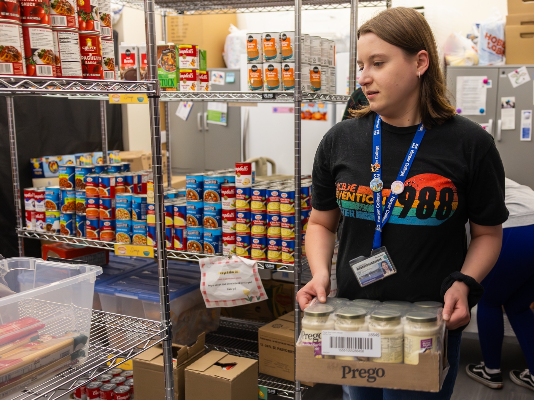 Hawks Care Pantry Hawks Care employees restock the Hawks Care Pantry at Harper College